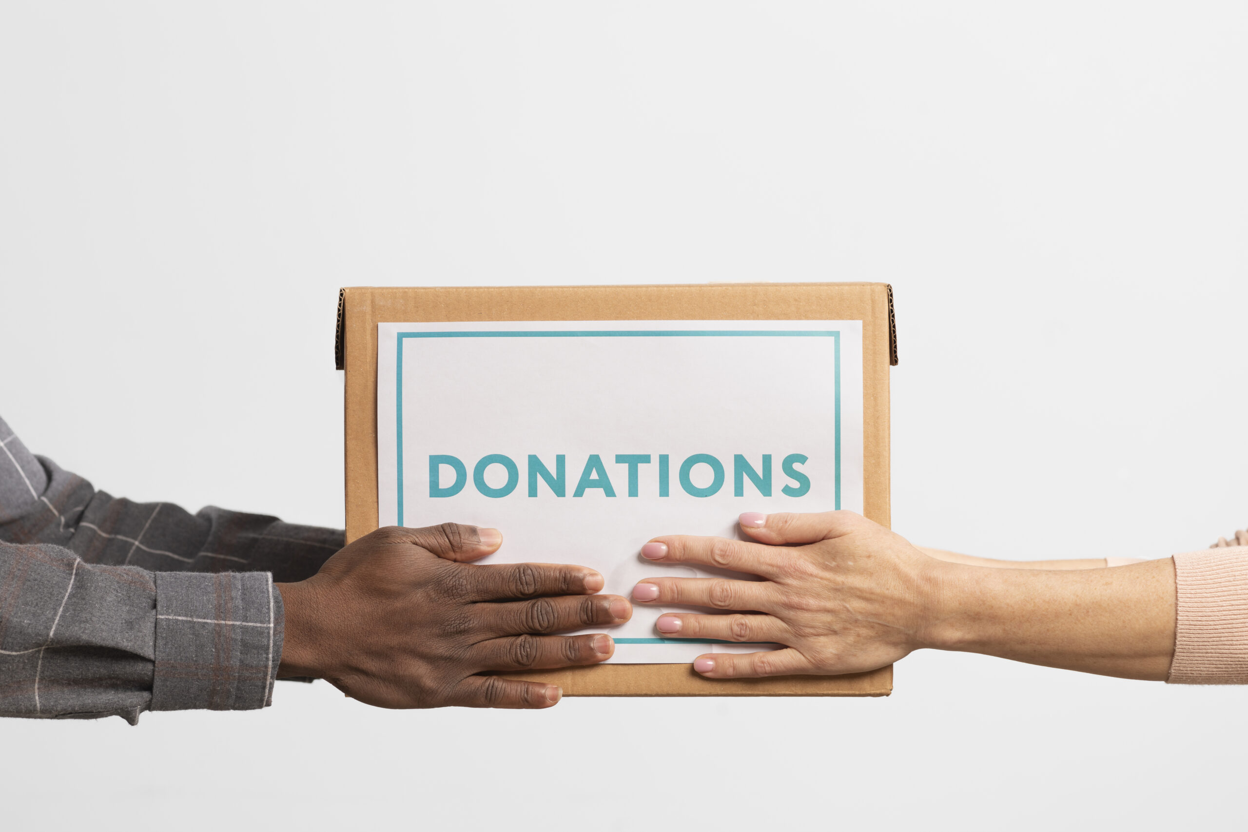 volunteer-giving-box-with-donations-another-volunteer